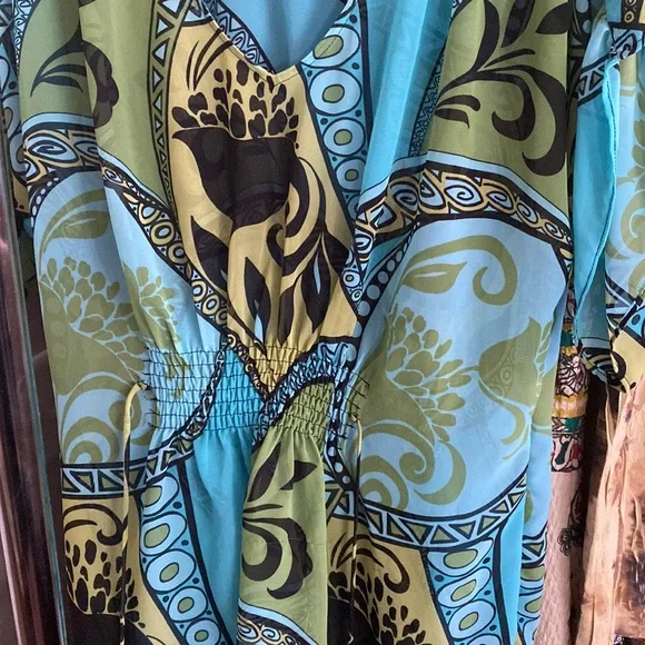 Shear colorful blouse with waist tie in front and back. - Picture 2 of 3